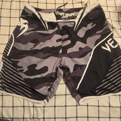 The Venum Camo Hero 3-Way Vault Fight Shorts