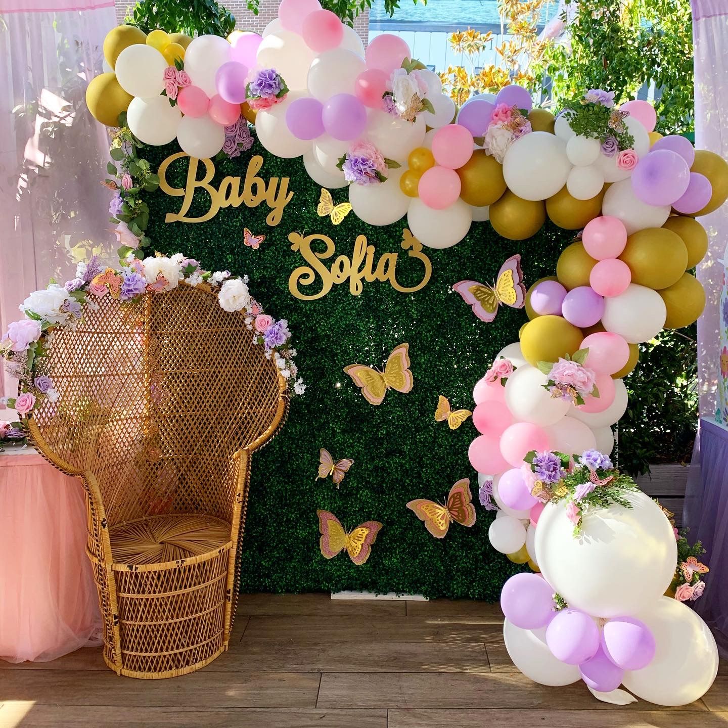 Baby shower set up, baby blocks, peacock chair, balloon garlands/archs