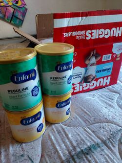 Brand new box of newborn Huggies diapers ×2 cans of Enfamil reguline×2 infant formula