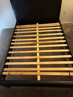 Full-size black bed frame/headboard