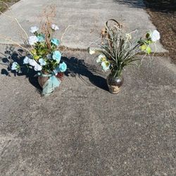 TWO LT BLUE AND WHÌTE ARTIFICIAL PLANTS AND VASE