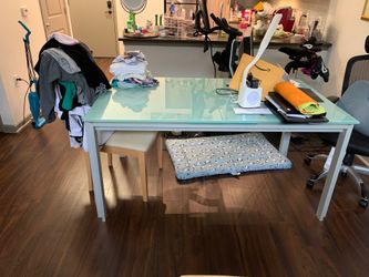 Glass dining room table with two chairs