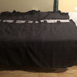 Two 28” x 36” sheer curtains with a 56” x 14” sheer valance in black