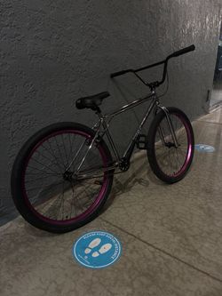 chrome 26 inch elite bike wit purple rims(LOOK AT DESCRIPTION)