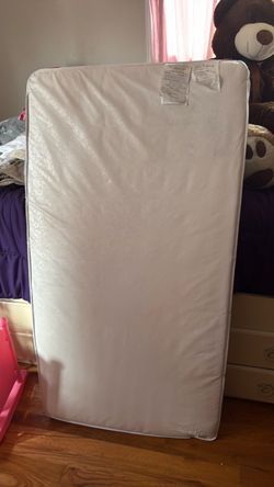 Crib mattress with cover size 52 X 27 1/2 inches