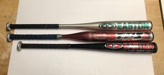 2 baseball and a softball bat