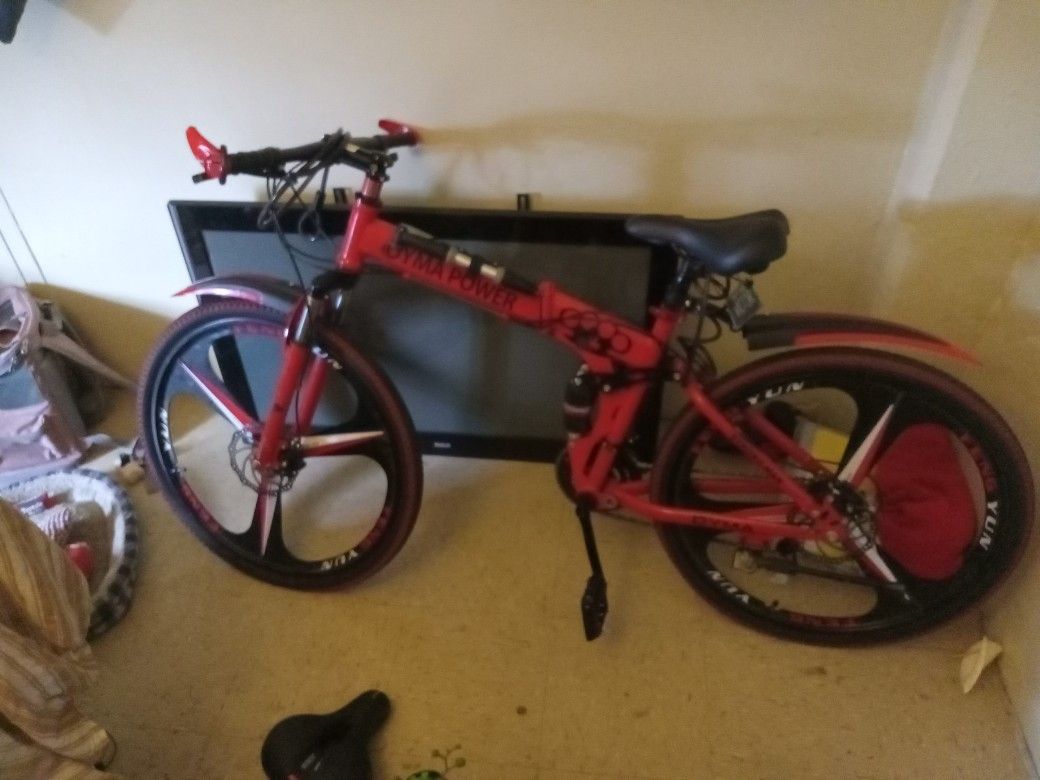 Red Folding Bicycle With Helmet