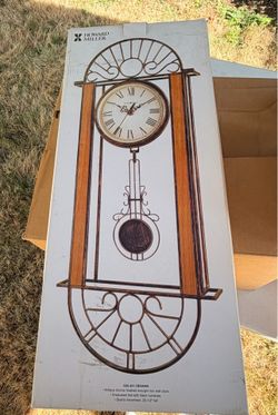 Wrought iron wall clock