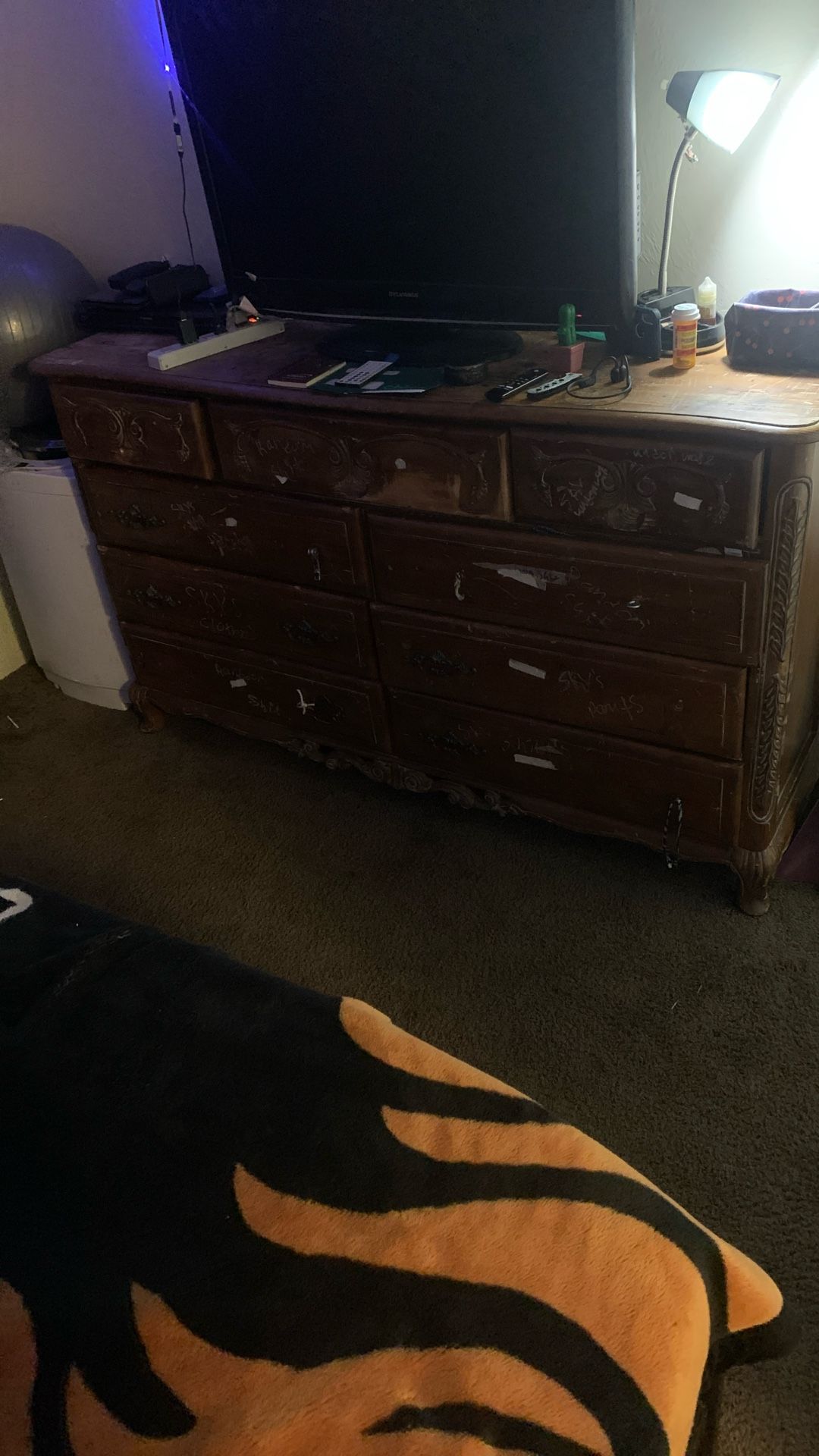 9 Long Drawer Dresser has a little bit of scuffing marks and is missing a couple knobs. It does come with a mirror that goes on the back of it.