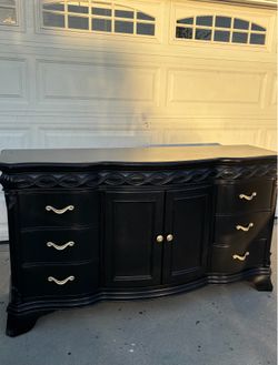 Black dresser or sideboard 68L X 19W X 38H