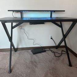 Black and carbon fiber laminate gaming desk. 