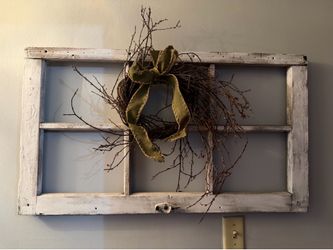Wooden window decorative frame with small wreath