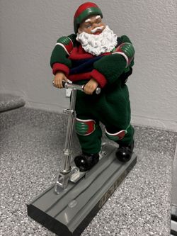 Singing Scooter Santa , Moves Back and forth.