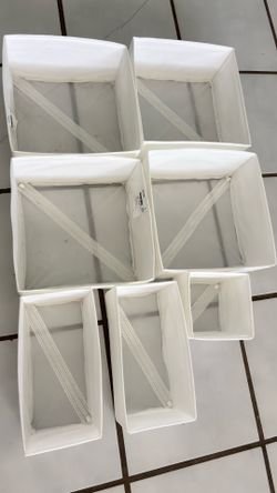 These white fabric organizer boxes are designed to keep items such as socks, underwear, and accessories tidy in your drawers or closets—from IKEA.