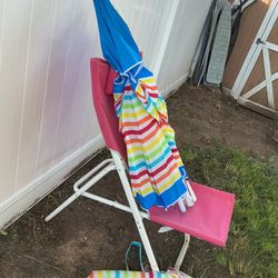 An Almost New. Beach Umbrella , With A Nice Folding Chair( Needs A Little Cleaning