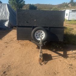 Used 6 X 10 Utility Trailer 4 Foot Side Walls three new tires, including the spare