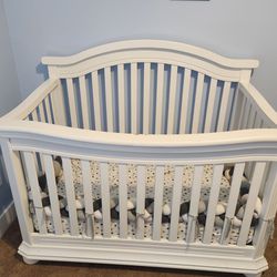White Baby Crib. Free Braided Long 
Cushion

