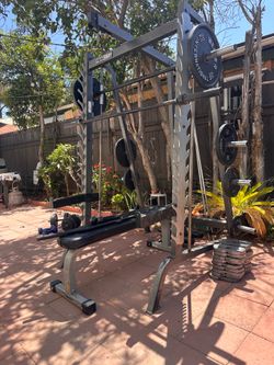OLYMPIC SQUAT RACK SMITH MACHINE WITH OLYMPIC WEIGHTS AND BENCH