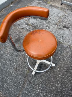 ORANGE SWIVEL CHAIR