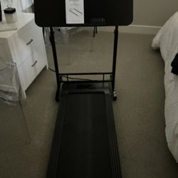 LIKE NEW,WALKING PAD TREADMILL WITH REMOTE CONTROL AND MOBILE STAND WITH WHEELS,SEE PHOTOS PAID $200. BUY $100.00