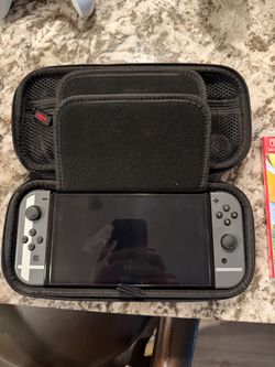 Nintendo Switch OLED Bundle + Let’s Go Pikachu + 2 Controllers