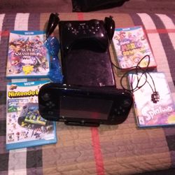 Nintendo Wii U 4 Games Two Controllers  Two Knuchucks Mobile Nintendo Wi i Portable Gamepad $80