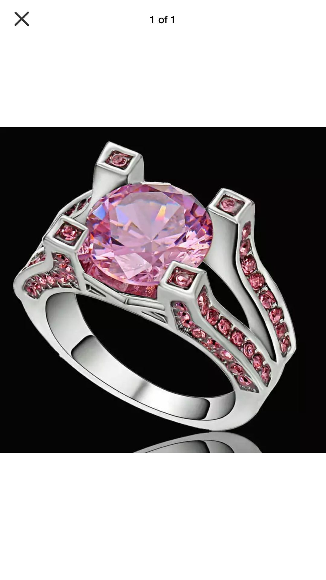 Modern engagement ring pink sapphires channel set on triple split bands and claw with round center sapphire on sterling silver band sz7