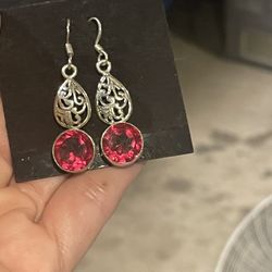 Solid sterling silver. earrings pink gemstone dangle 1.5”long  Never been worn