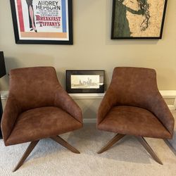 2 Andreu World Suede Swivel Chairs $950