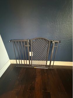 Baby gate. Standard door size 37in + extenders