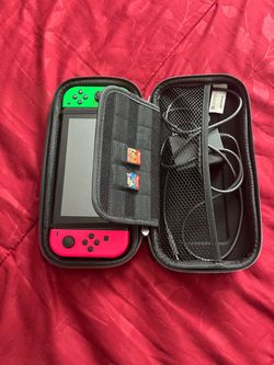Nintendo switch with red and green controllers