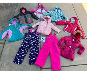 Huge selection of kids snow clothes size 5-6. Jackets pants and bibs