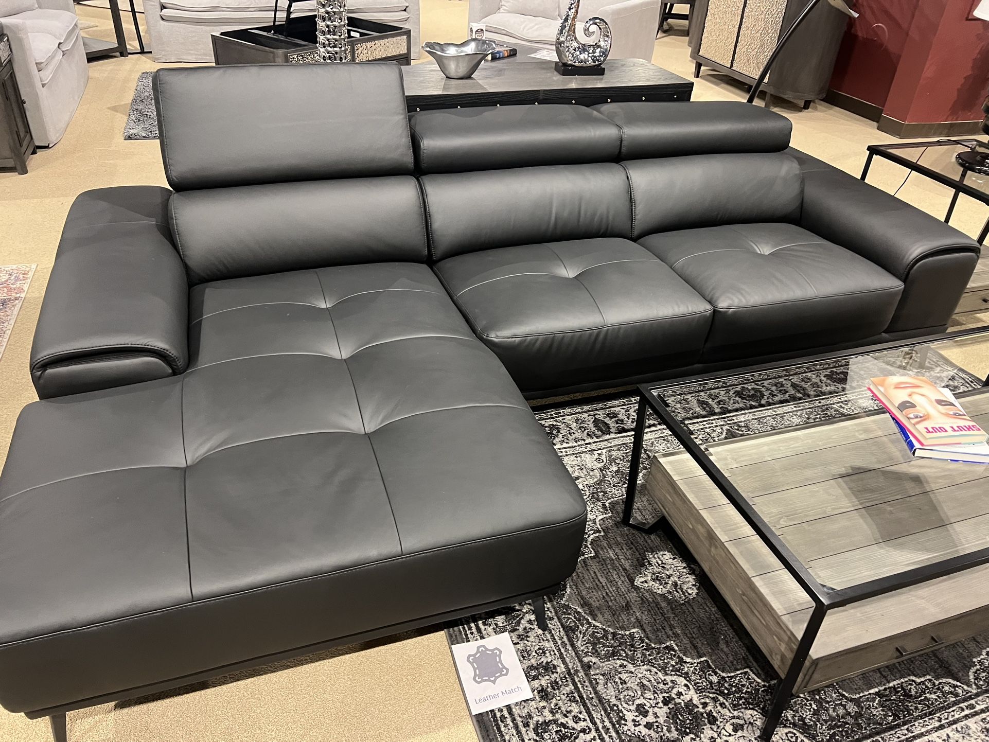 New Sectional W Adjustable Headrests. Black Leather Match/ Metal Legs. 110x68Dx29H. Free Delivery!