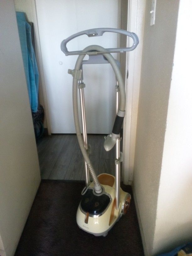Steamer For A Wrinkle Free Clothes And Strong