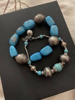 Two silver bracelets with turquoise stones