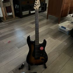 Guitar + Stand + Digital Tuner + Strings + String Winder/Cutter