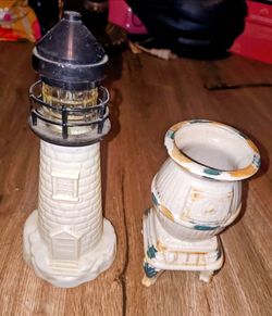 Vintage Avon lighthouse and pot belly stove
