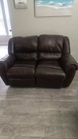 Brown love seat couch