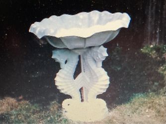 Antique sea horse decorated birdbath 4 feet by 4 1/2 feet