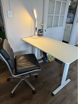 Lift desk  and chair and lamp.