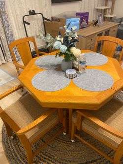 Table and four chairs on wheels