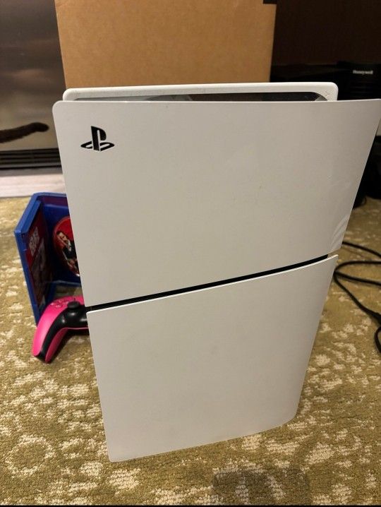 PS5 with two games and 3 controllers