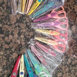 A Bunch Of Craft Scissors And Hole Punches
