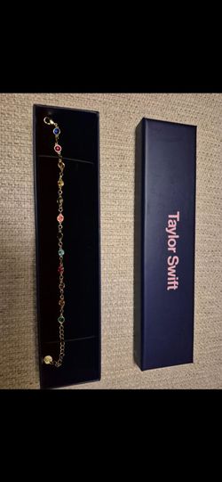 Taylor Swift merch Bejeweled bracelet and TTPD ring
