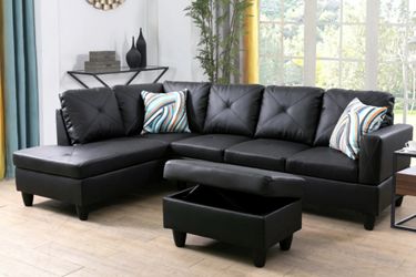 Black leather sectional couch and ottoman