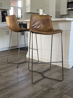 West Elm Real Genuine Leather matching high bar stools (floor to seat: 30”).  In great used condition. Price is for both.