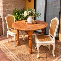 Round Wood Dining Table with 2 Cane Chairs