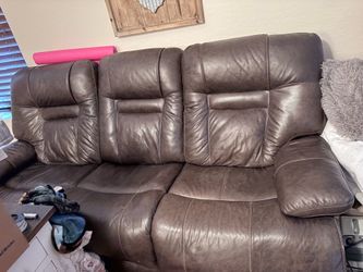 Brown electric reclining couch