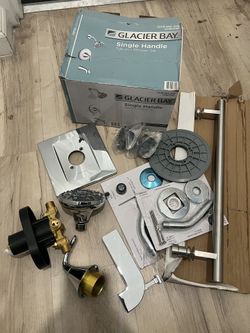 GLACIER BAY SINGLE HANDLE TUB AND SHOWER SET EVERYTHING BRAND NEW ONLY MISSING FACE PLATE CAN FIND ONLINE ALSO COMES WITH EXTRA CHROME ACCESSORIES   $