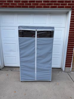 freestanding portable plastic wardrobe with a zippered cover and a clear plastic top windowx